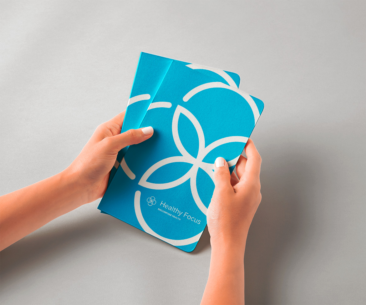 EH_Healthy_Focus_Hands-Holding-Classic-Notebooks-Mockup EH_Healthy_Focus_Hands-Holding-Classic-Notebooks-Mockup